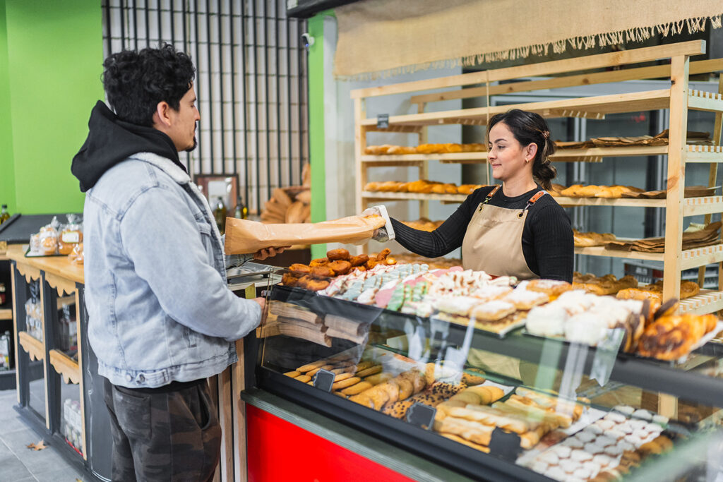 person buying food in bakery
