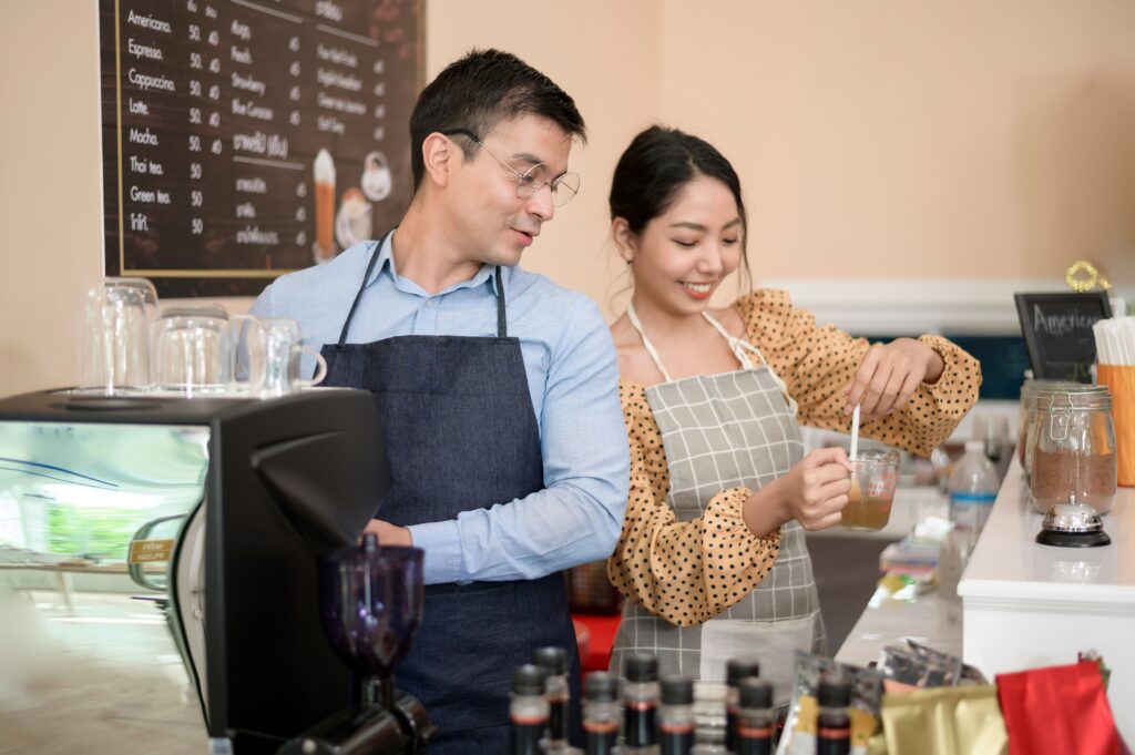 Baristas making and preparing a cup of coffee in coffee shop