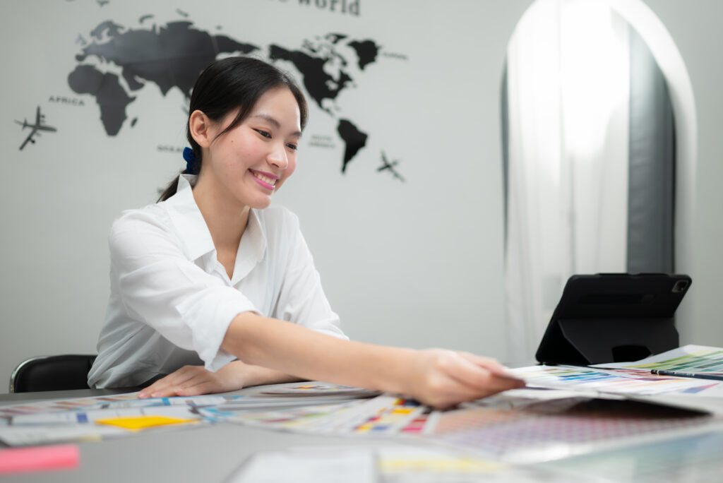 Young female architect and designer are rethinking the choice of color scheme for designing a smartphone application.