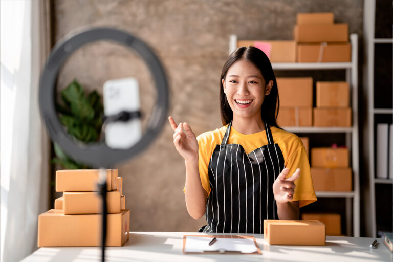 businesswoman filming at home